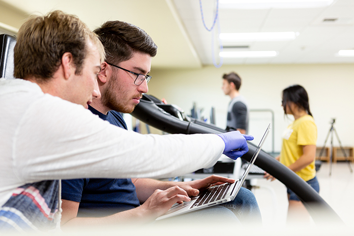 students on laptop